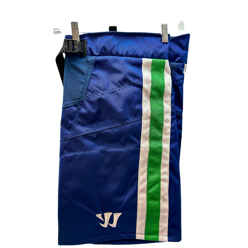 Warrior NHL Pro Return Vancouver Canucks Pant Shells folded in half showing Warrior logo, hanging from clothes  hanger