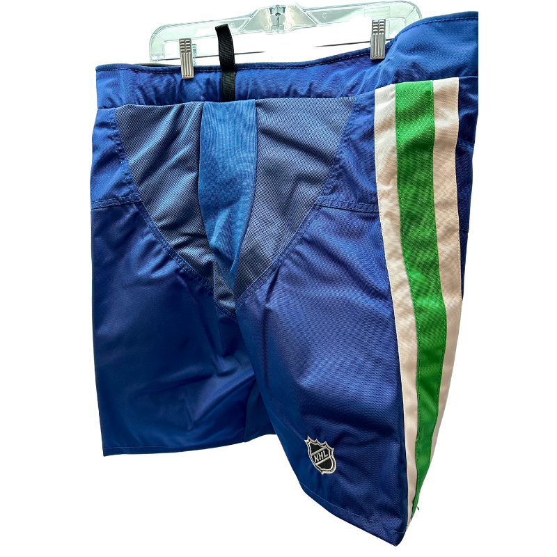 Warrior NHL Pro Return Vancouver Canucks Pant Shells back hanging from clothes hanger