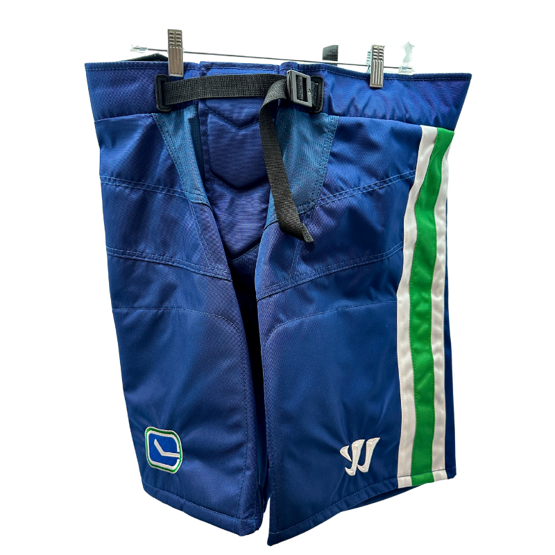 Warrior NHL Pro Return Vancouver Canucks Pant Shells front hanging from clothes hanger