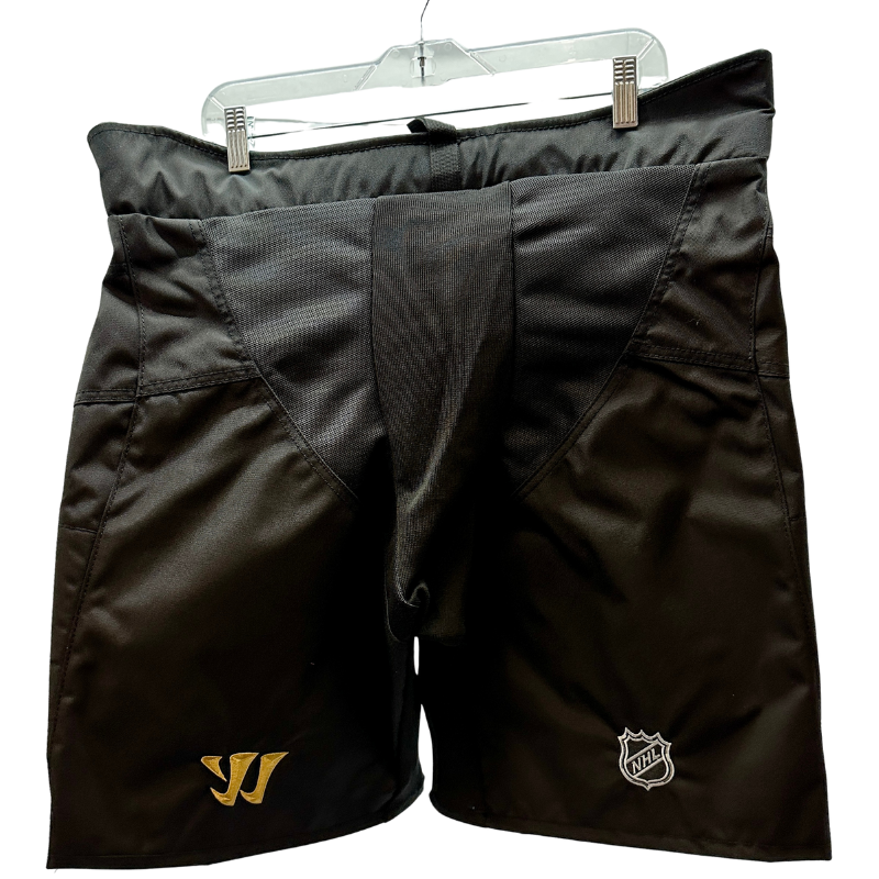 Warrior NHL Pro Return Vegas Golden Knights Pant Shells back showing Warrior and NHL logos, handing from clothes hanger