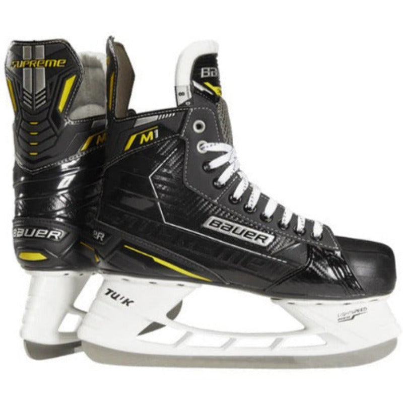 Bauer Hockey Skates Bauer Supreme M1 Junior Black Yellow back of one skate and the side facing right of the other